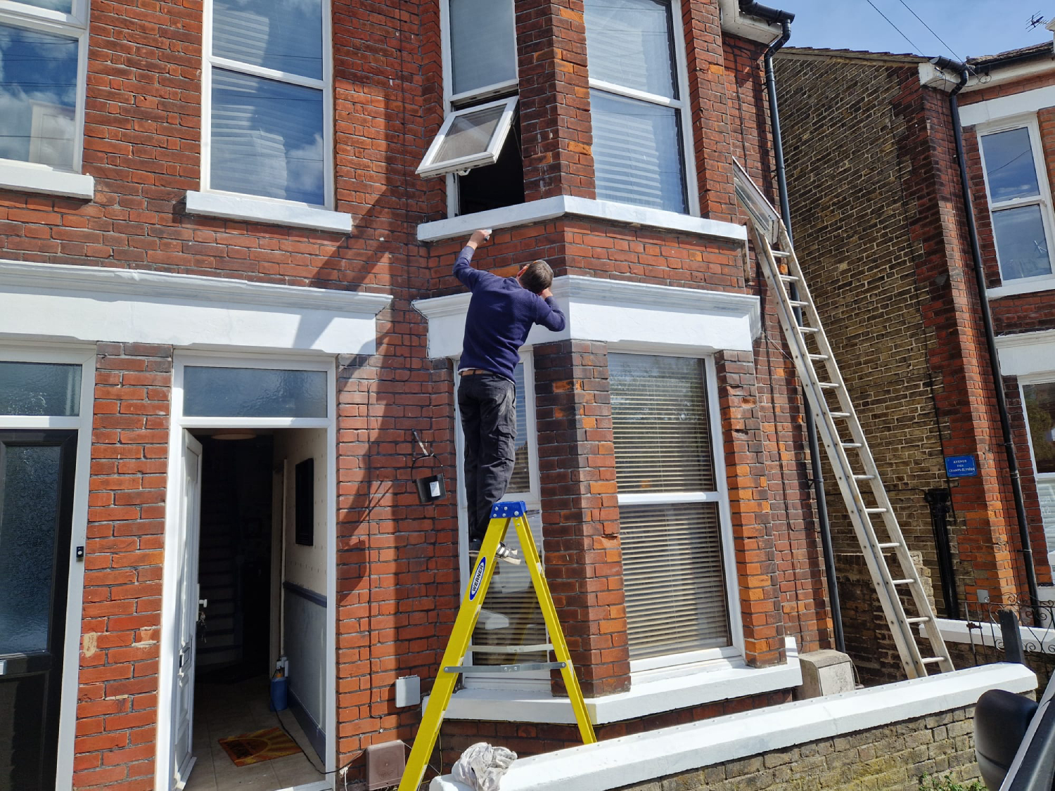 Exterior renovated and painted wall by House & House